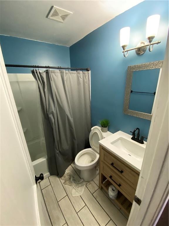 3734 Travis Blvd, Macon, GA 31206 - bathroom with vanity, toilet, and shower / tub combo