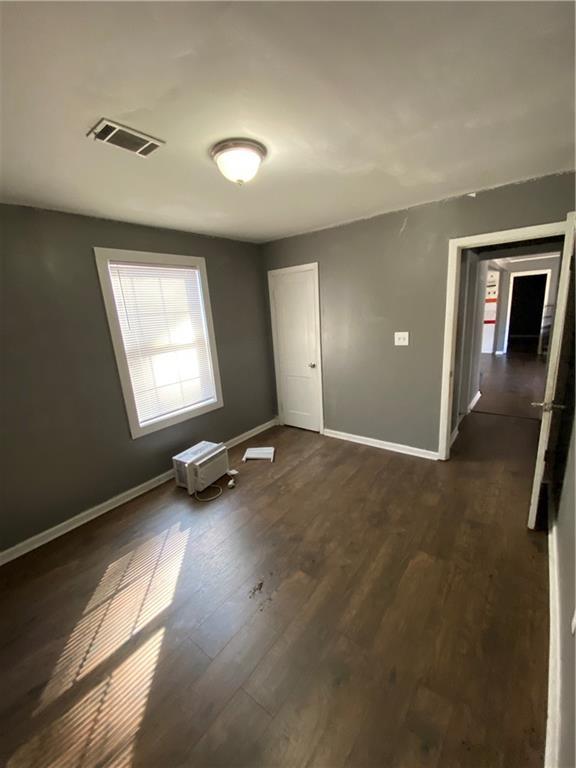 3734 Travis Blvd, Macon, GA 31206 - spare room with baseboards and dark wood-style floors