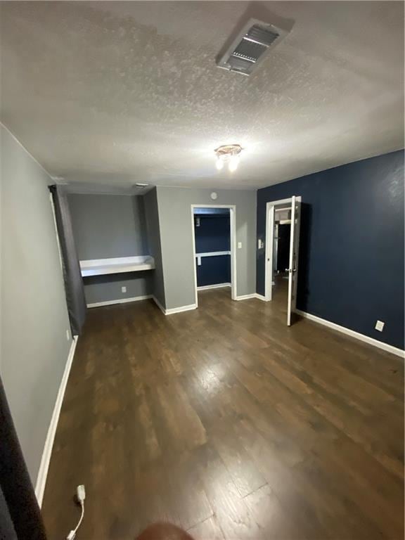3734 Travis Blvd, Macon, GA 31206 - spare room with wood finished floors, baseboards, and a textured ceiling