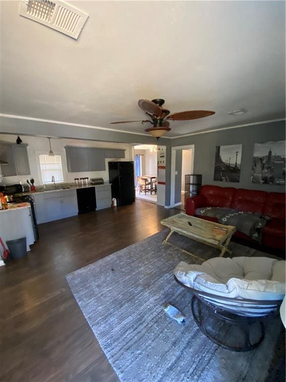 3734 Travis Blvd, Macon, GA 31206 - living area featuring a ceiling fan and dark wood-style floors