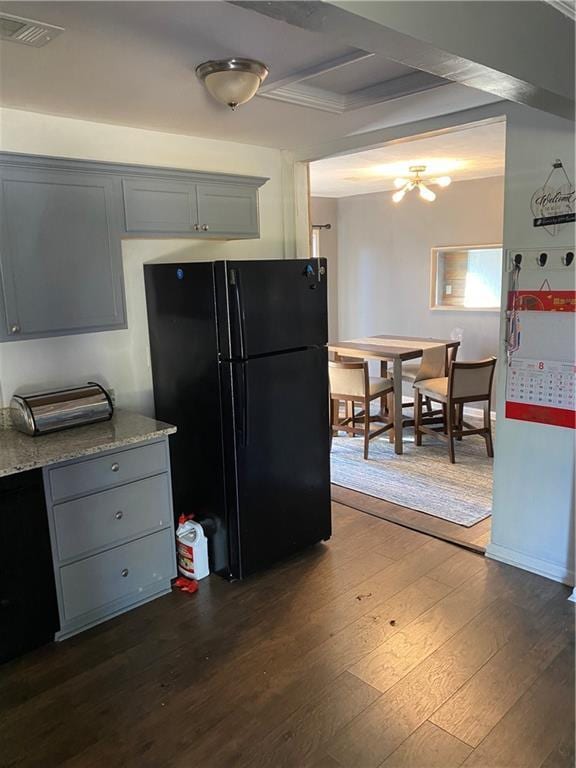 3734 Travis Blvd, Macon, GA 31206 - kitchen featuring freestanding refrigerator, gray cabinetry, dark wood-type flooring, and beamed ceiling