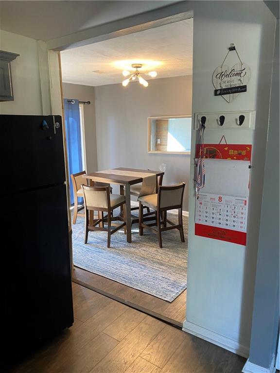 3734 Travis Blvd, Macon, GA 31206 - dining space with hardwood / wood-style floors and a chandelier