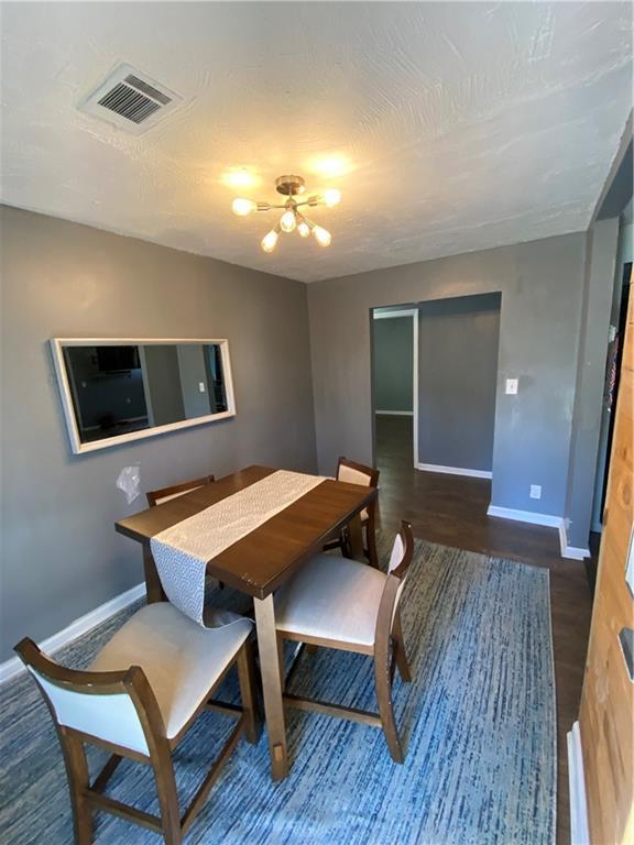 3734 Travis Blvd, Macon, GA 31206 - dining space featuring baseboards and wood finished floors