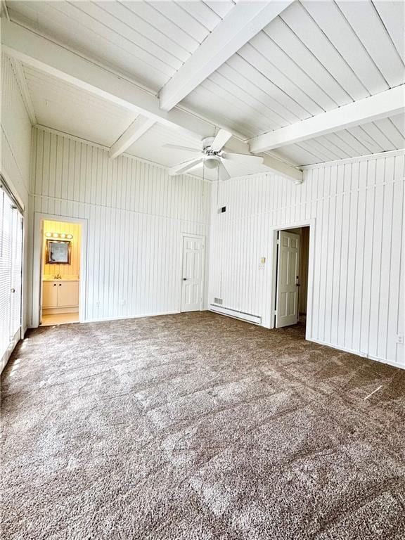 empty room featuring beamed ceiling, a ceiling fan, and carpet floors