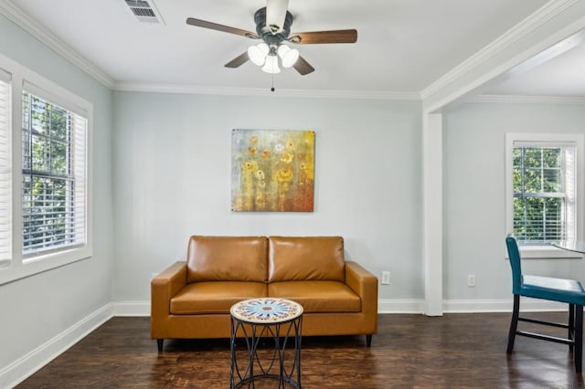 sitting room featuring dark wood-style floors, baseboards, visible vents, and a wealth of natural light