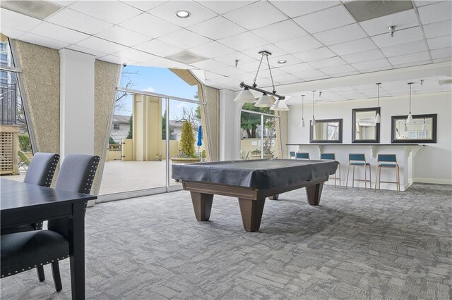 rec room with a paneled ceiling, carpet flooring, and pool table