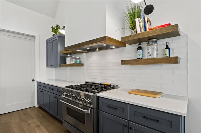 kitchen with open shelves, backsplash, stainless steel stove, and gray cabinets