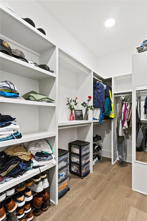 walk in closet featuring wood finished floors