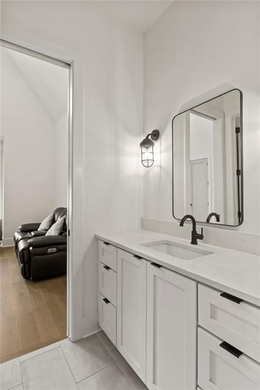 bathroom with tile patterned flooring and vanity