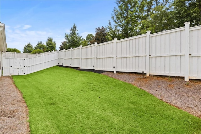 view of yard with a fenced backyard