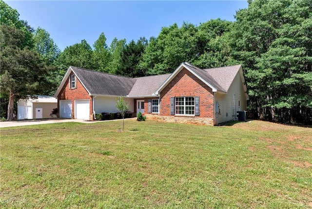ranch-style home with a front lawn, stone siding, brick siding, central AC unit, and driveway