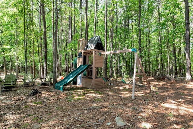 view of play area with a view of trees