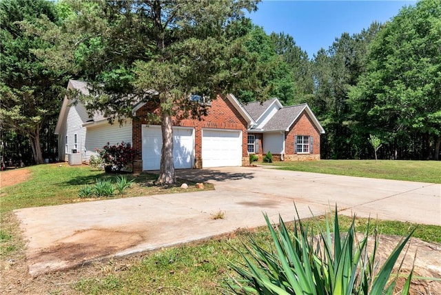 view of front of home with an attached garage, driveway, a front lawn, and brick siding