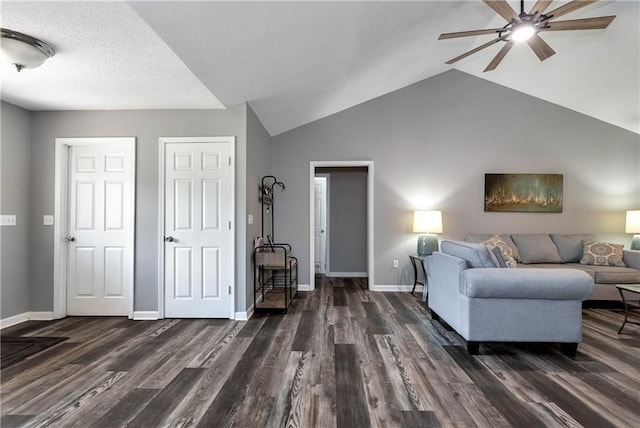 living room with vaulted ceiling, baseboards, a ceiling fan, and wood finished floors