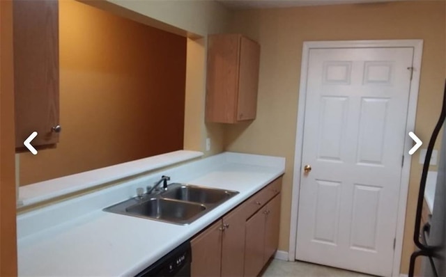 kitchen featuring sink and black dishwasher