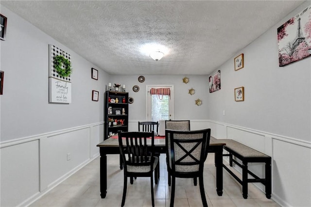 dining area featuring a textured ceiling