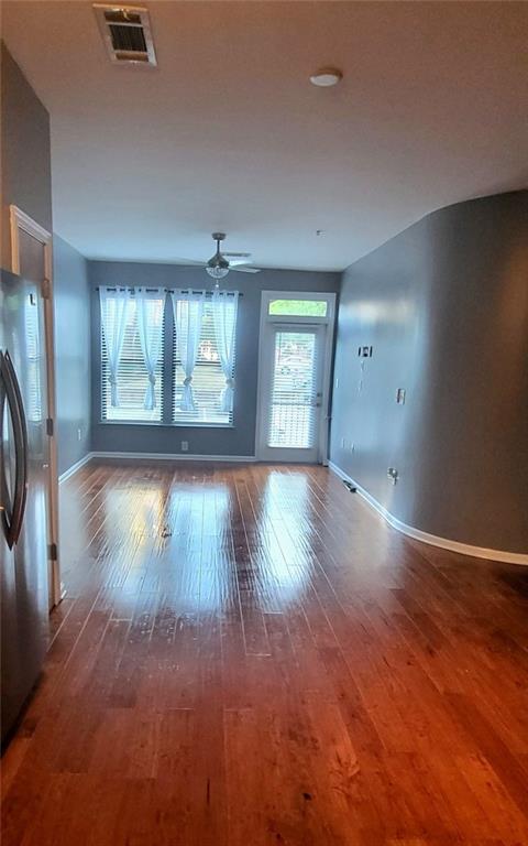 spare room with ceiling fan and hardwood / wood-style floors