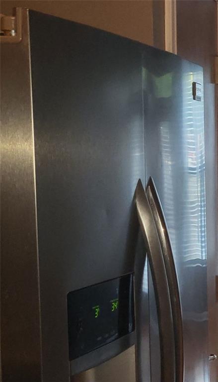 room details with stainless steel fridge