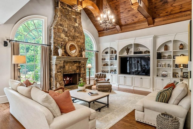 living room with dark wood-type flooring, high vaulted ceiling, a chandelier, a fireplace, and wood ceiling