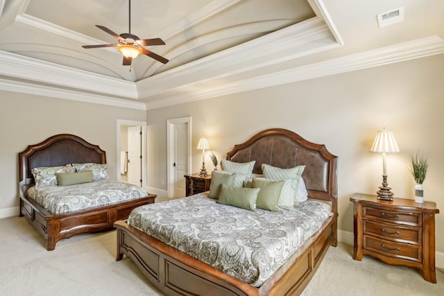 bedroom featuring a tray ceiling, ceiling fan, light colored carpet, and ornamental molding