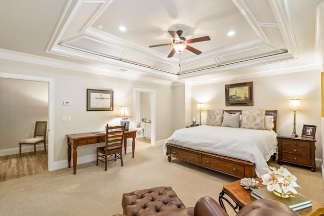 carpeted bedroom featuring a raised ceiling, ceiling fan, and ornamental molding