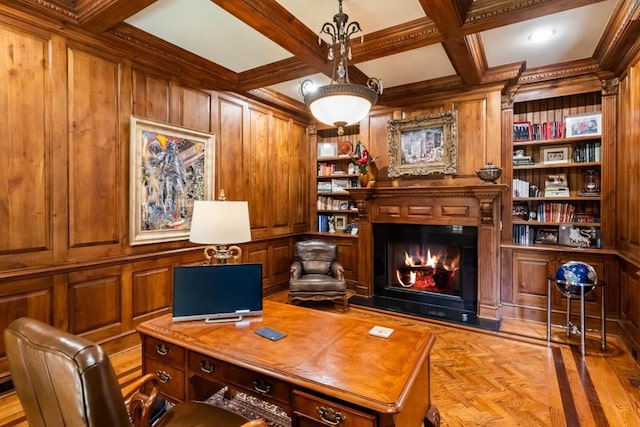 office space featuring built in shelves, wooden walls, and light parquet flooring