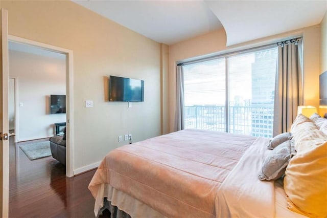 bedroom with dark wood-type flooring