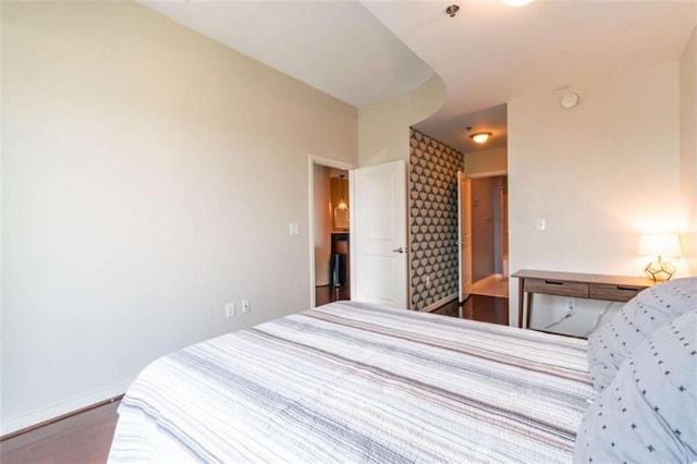 bedroom featuring dark hardwood / wood-style flooring