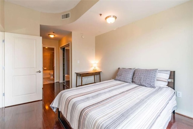 bedroom featuring dark wood-type flooring