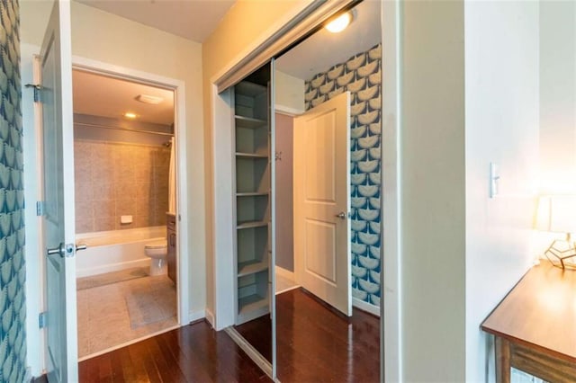 full bathroom featuring vanity, separate shower and tub, hardwood / wood-style floors, and toilet