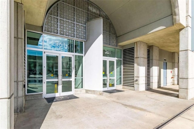 view of exterior entry featuring french doors