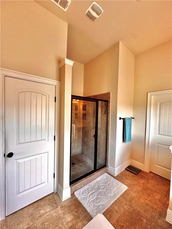 520 Harmony Way, Locust Grove, GA 30248 - full bathroom with a shower stall and baseboards
