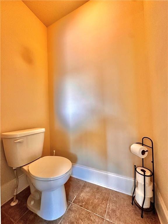 520 Harmony Way, Locust Grove, GA 30248 - bathroom featuring toilet, tile patterned flooring, and baseboards