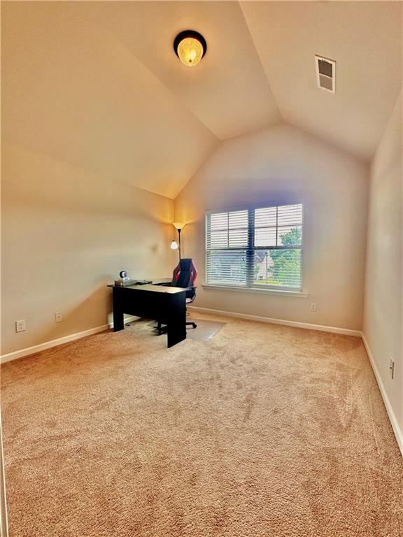 520 Harmony Way, Locust Grove, GA 30248 - unfurnished office featuring lofted ceiling, carpet floors, and baseboards
