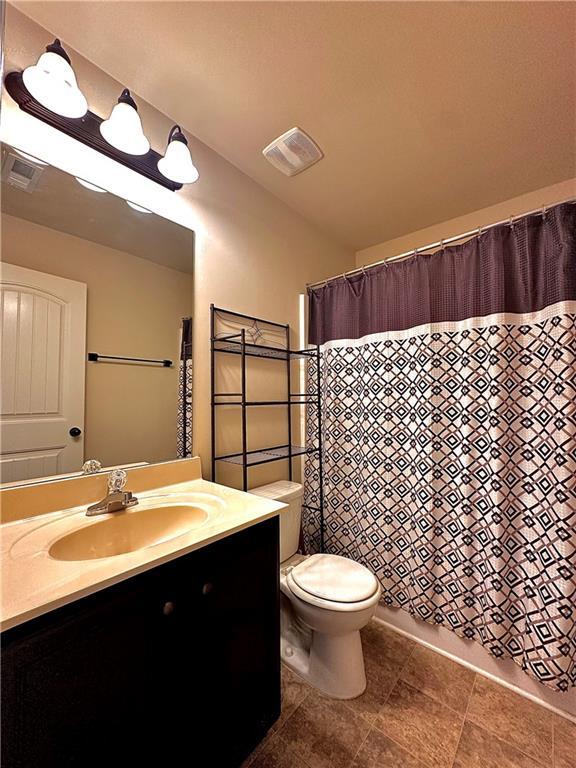 520 Harmony Way, Locust Grove, GA 30248 - full bathroom featuring vanity and toilet