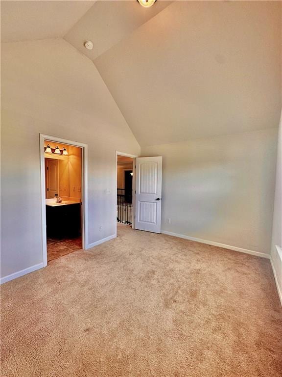 520 Harmony Way, Locust Grove, GA 30248 - unfurnished bedroom featuring carpet floors, baseboards, high vaulted ceiling, and ensuite bathroom