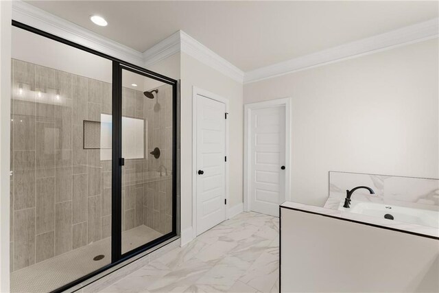 bathroom featuring a shower with shower door and ornamental molding