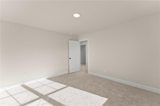 unfurnished room featuring carpet flooring