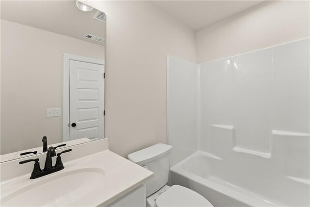 full bathroom with toilet, shower / washtub combination, and vanity