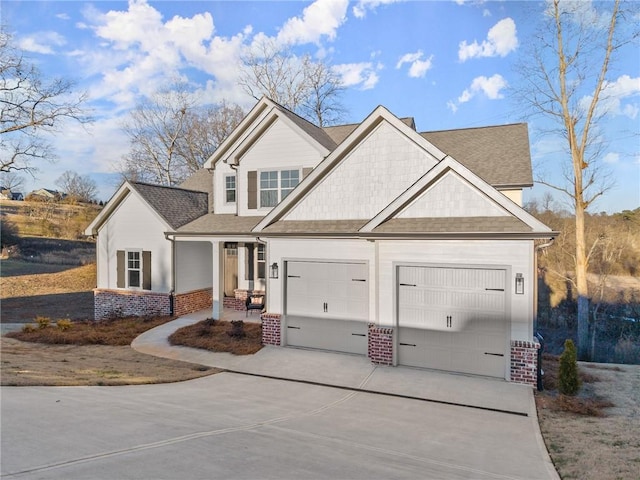 view of front of home featuring a garage and a porch