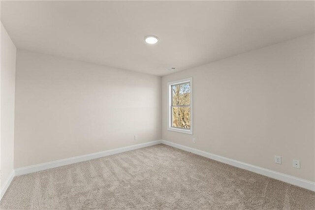 unfurnished room with carpet