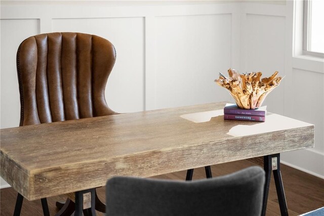 dining space with wood-type flooring