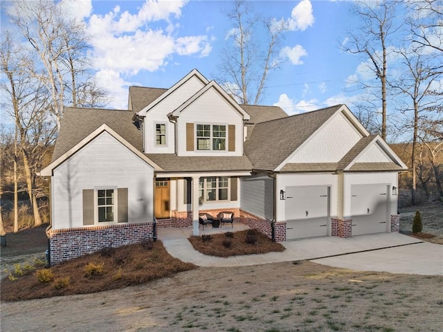 view of front of home featuring a garage and a porch