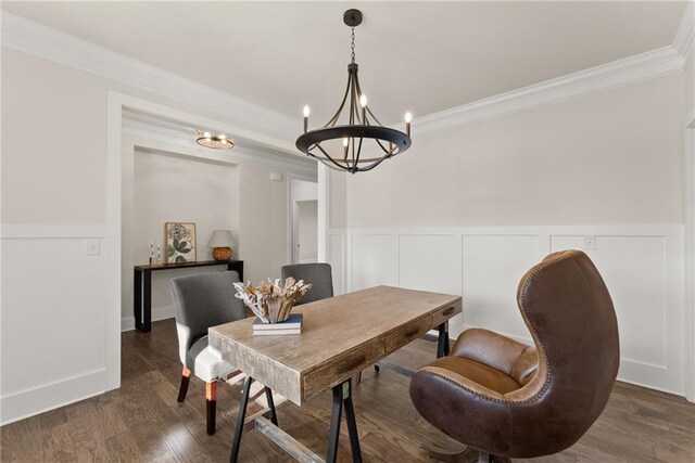 dining space with an inviting chandelier, ornamental molding, and dark hardwood / wood-style floors