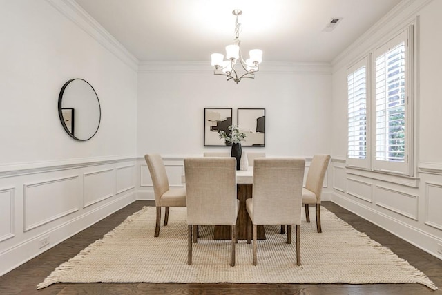 11760 Stratham Dr, Alpharetta, GA 30009 - dining area featuring a chandelier, healthy amount of natural light, dark wood-style floors, ornamental molding, and a decorative wall
