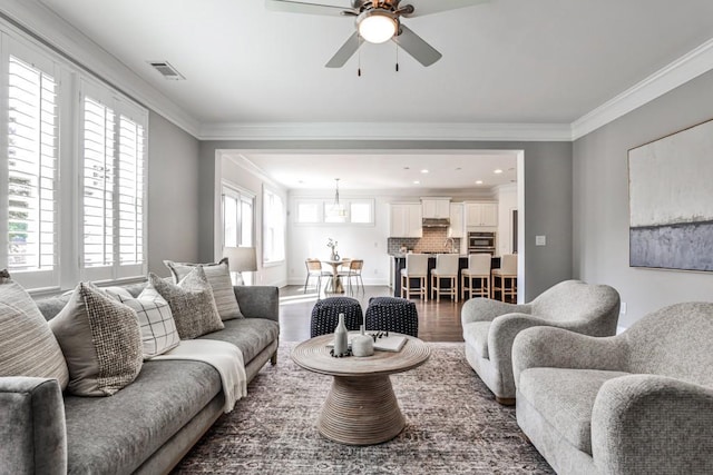 11760 Stratham Dr, Alpharetta, GA 30009 - living area with wood finished floors, ceiling fan, crown molding, and recessed lighting