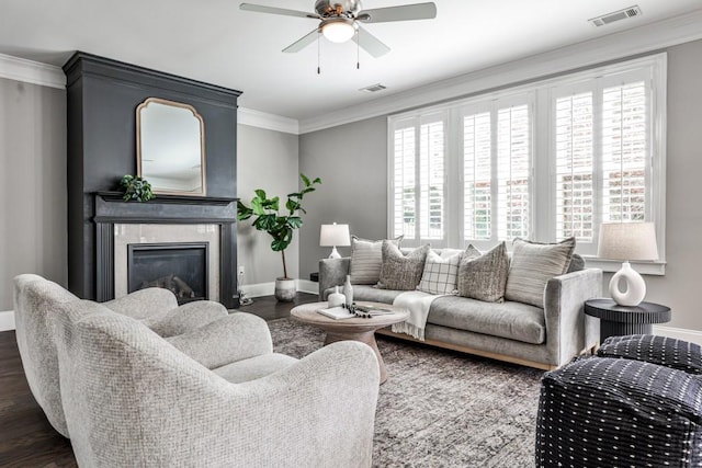11760 Stratham Dr, Alpharetta, GA 30009 - living room with ceiling fan, dark wood-style floors, a glass covered fireplace, and crown molding