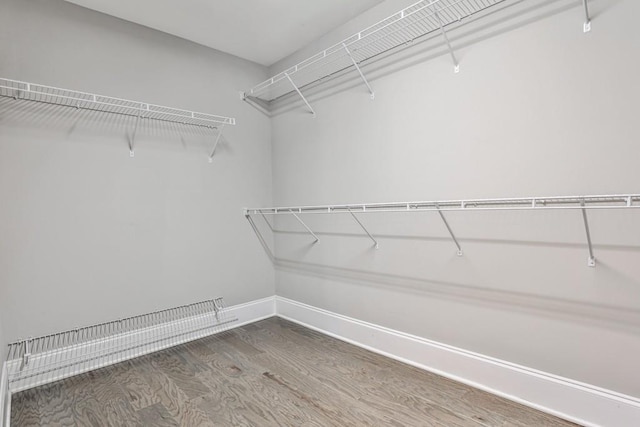 11760 Stratham Dr, Alpharetta, GA 30009 - walk in closet featuring wood finished floors