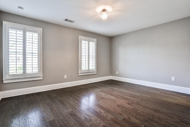 11760 Stratham Dr, Alpharetta, GA 30009 - empty room featuring dark wood-type flooring and a smoke detector