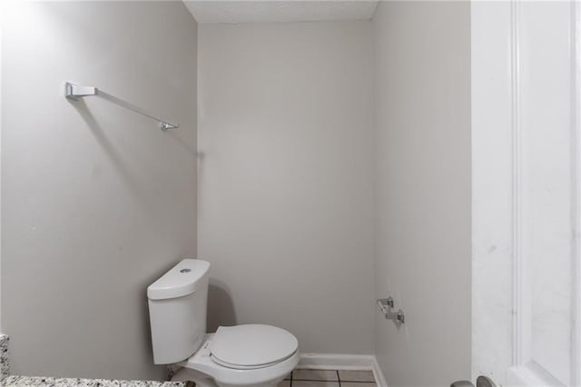 1406 Windy Ridge Ct SE, Conyers, GA 30013 - bathroom with toilet, tile patterned floors, and baseboards